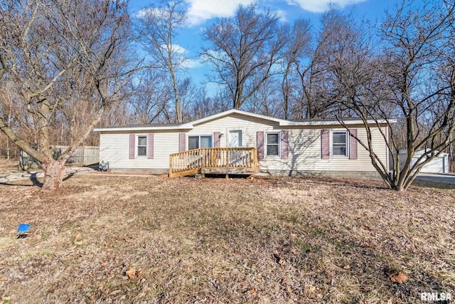 manufactured / mobile home with fence and a deck