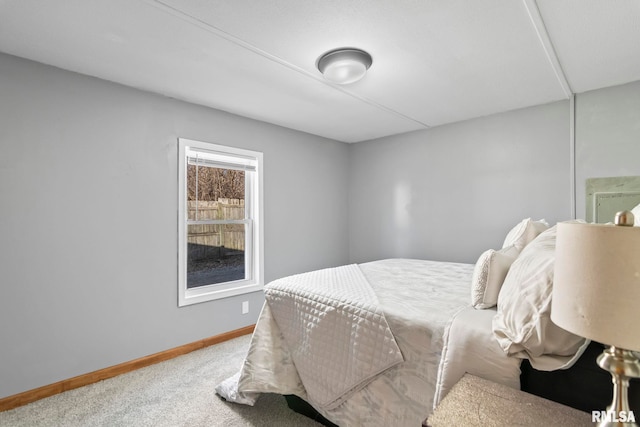 carpeted bedroom with baseboards