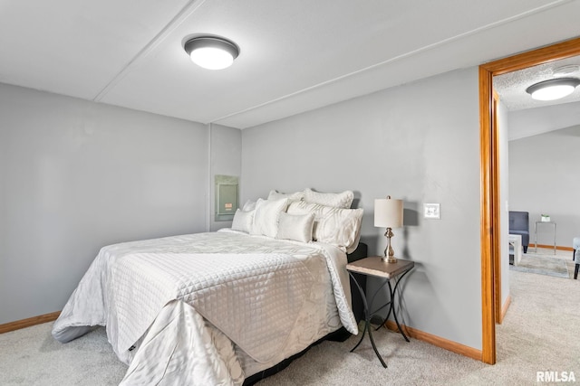 bedroom with carpet and baseboards