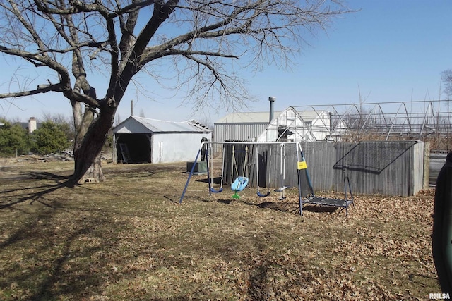 view of yard with an outbuilding and a playground