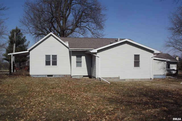 back of property featuring crawl space and a shingled roof