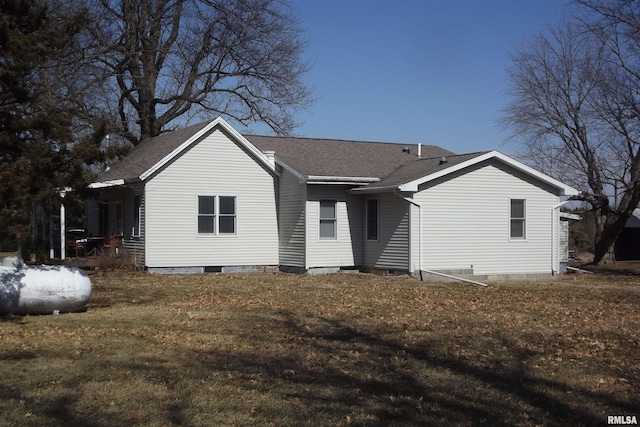 back of property with crawl space and roof with shingles