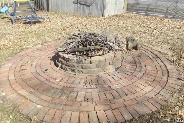 view of patio featuring an outdoor fire pit