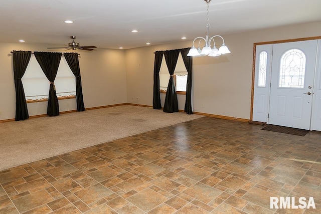 foyer featuring baseboards, a healthy amount of sunlight, carpet, and recessed lighting