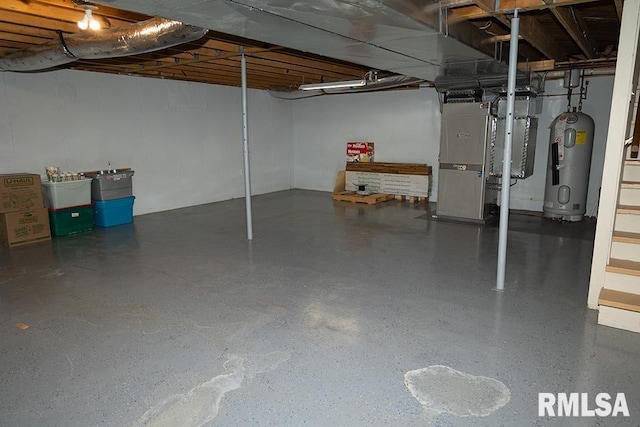 unfinished basement featuring water heater and heating unit