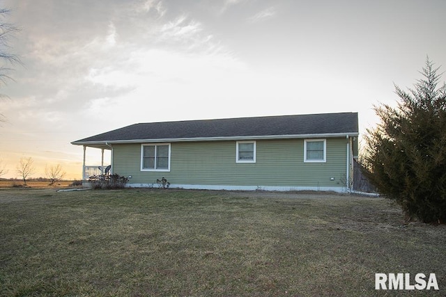 view of property exterior with a lawn