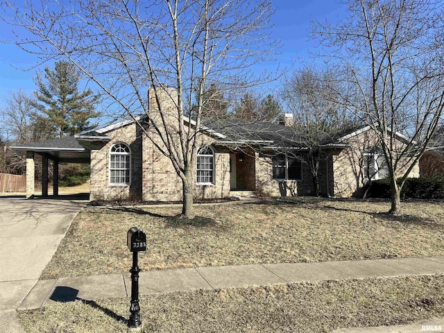 3305 Collingwood Dr, Springfield, IL 62711 - ranch-style house featuring a chimney, concrete driveway, and a carport