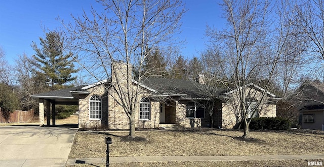 3305 Collingwood Dr, Springfield, IL 62711 - ranch-style home featuring an attached carport, a shingled roof, and concrete driveway