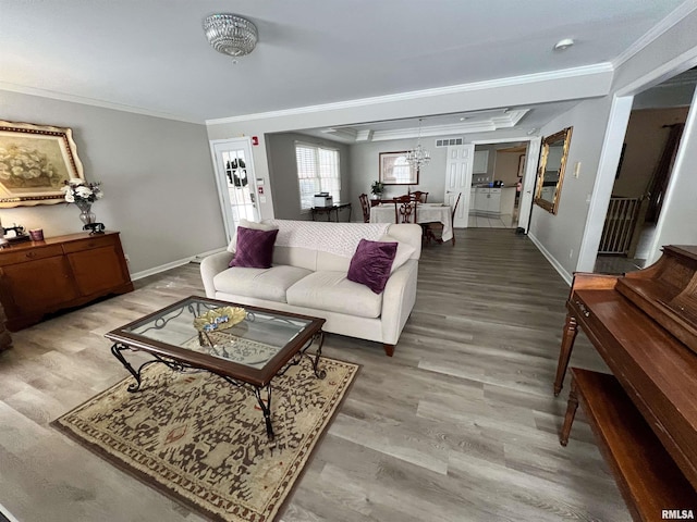 3305 Collingwood Dr, Springfield, IL 62711 - living room featuring baseboards, visible vents, ornamental molding, and wood finished floors