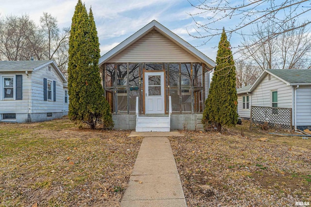 view of front of home with a sunroom