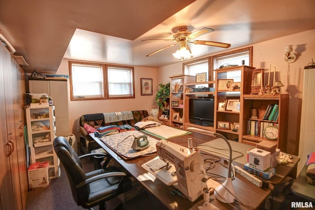 office space featuring a ceiling fan