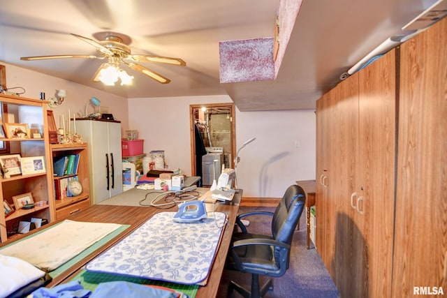 home office with ceiling fan and washer / clothes dryer