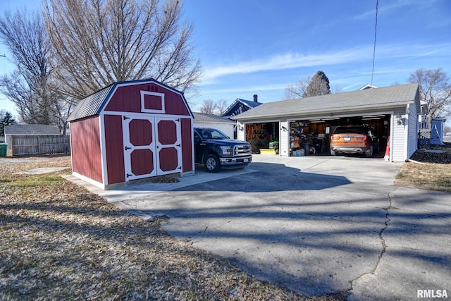 view of shed featuring fence