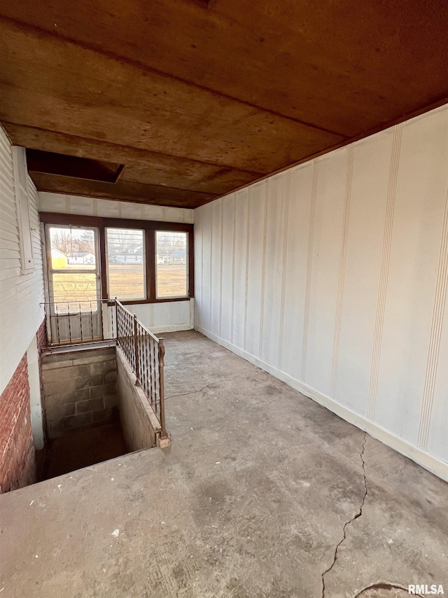 unfurnished room featuring concrete floors