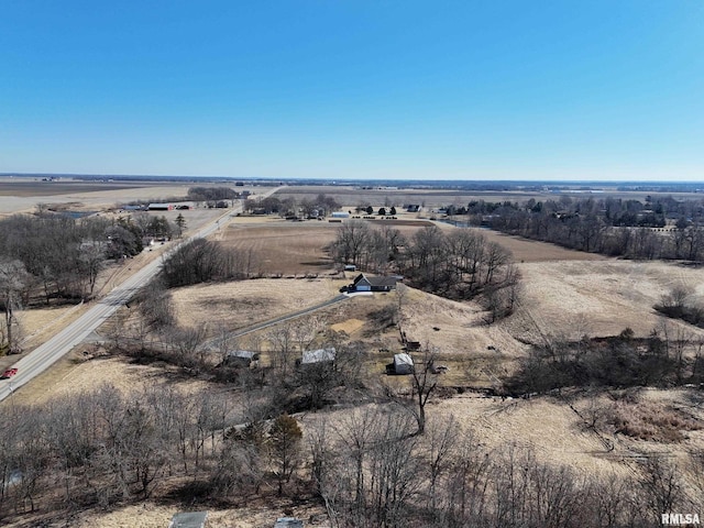 birds eye view of property with a rural view