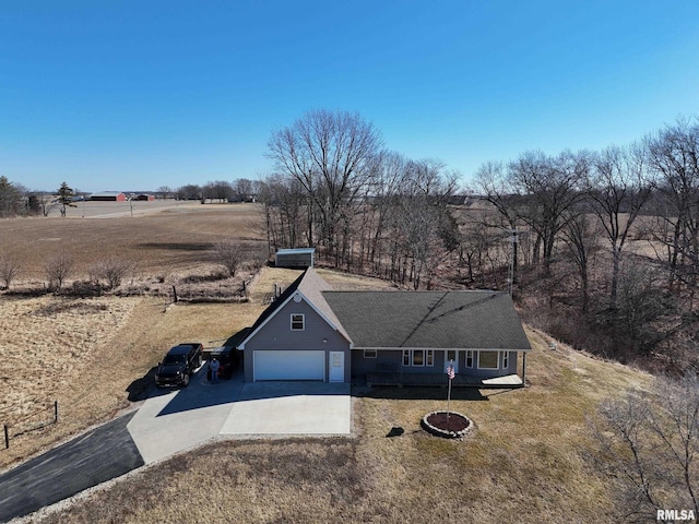 view of front of house with a garage, a front lawn, and concrete driveway