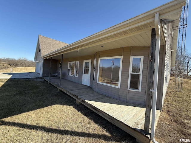 view of side of property featuring a wooden deck