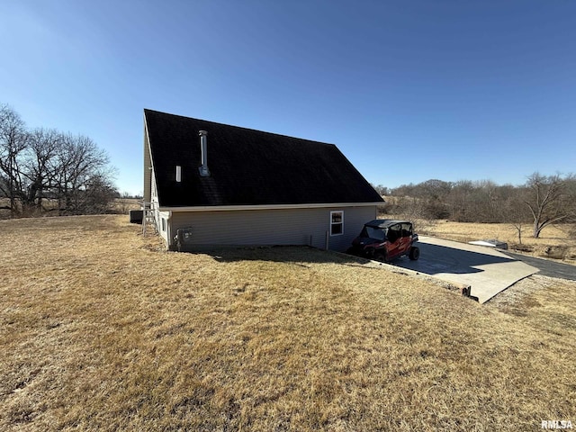 view of side of property featuring a yard