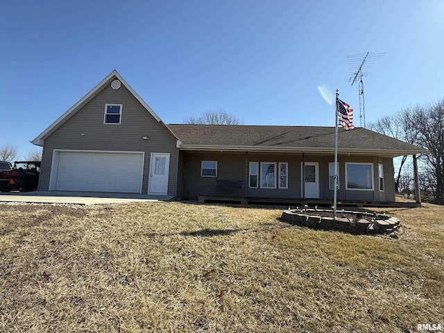 ranch-style house featuring an attached garage and a front yard