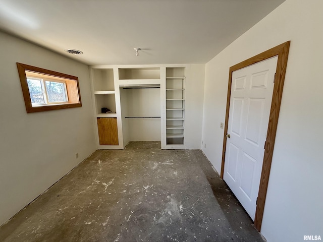 interior space featuring visible vents and a closet