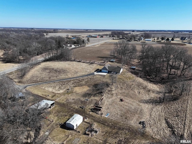 birds eye view of property with a rural view