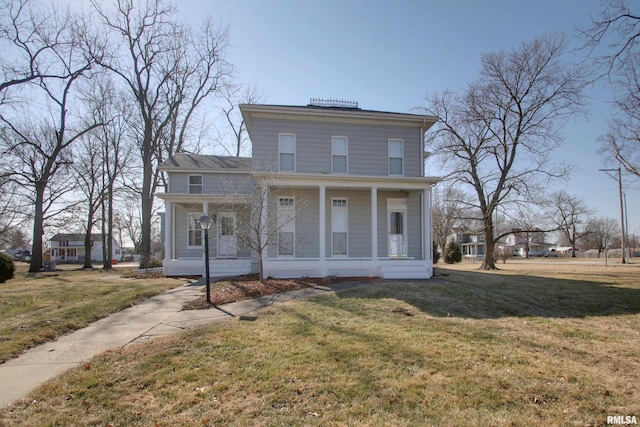 italianate home featuring covered porch and a front lawn