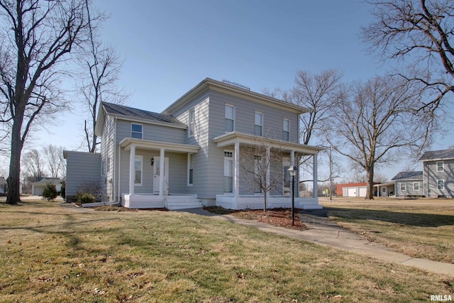 traditional style home with a front yard and covered porch