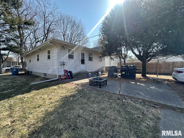 exterior space featuring a yard, entry steps, a patio area, and fence