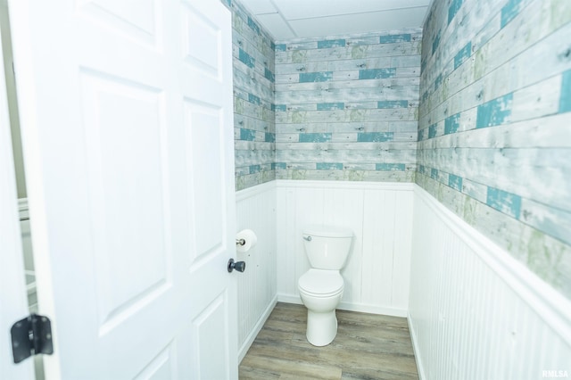bathroom featuring toilet and wood finished floors
