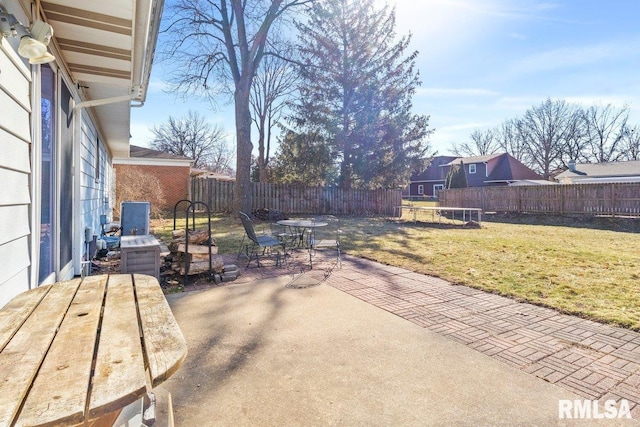 view of patio with outdoor dining space and a fenced backyard