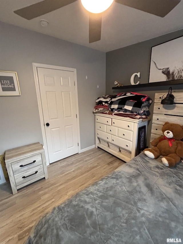 bedroom featuring ceiling fan and wood finished floors