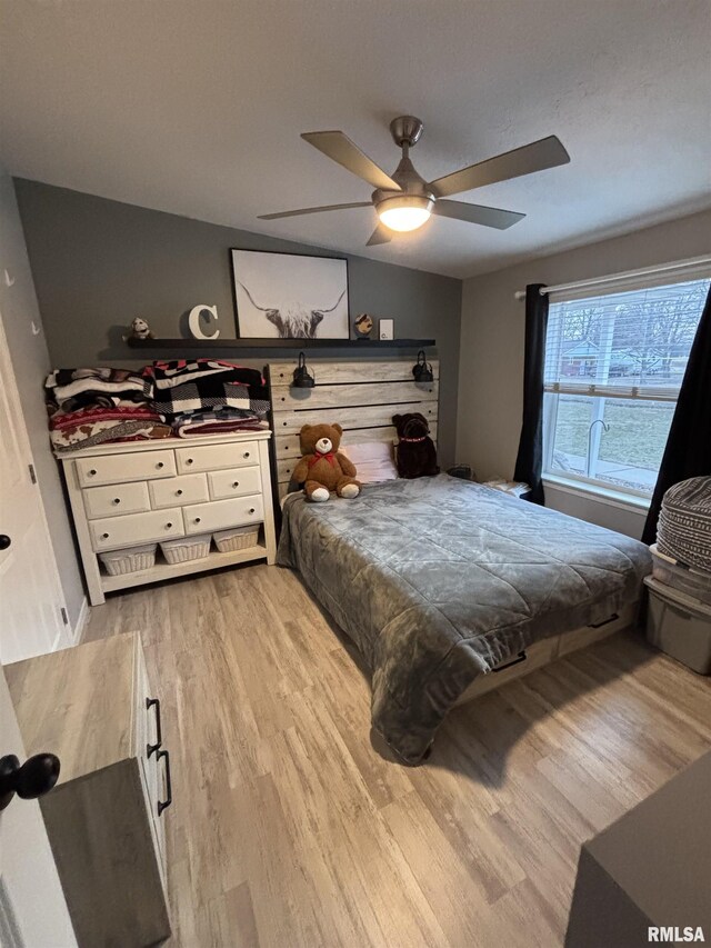 bedroom with wood finished floors and a ceiling fan