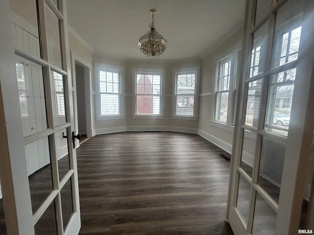 unfurnished sunroom featuring french doors and a notable chandelier