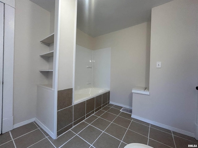 full bathroom featuring built in shelves, tile patterned flooring, visible vents, and baseboards