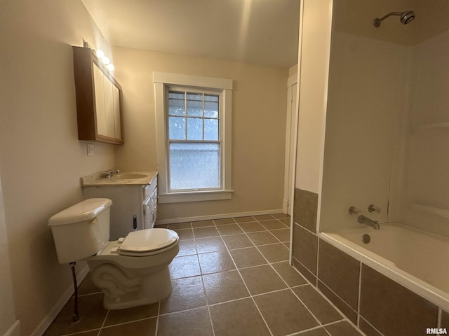 bathroom featuring baseboards, toilet, tiled shower / bath combo, tile patterned flooring, and vanity