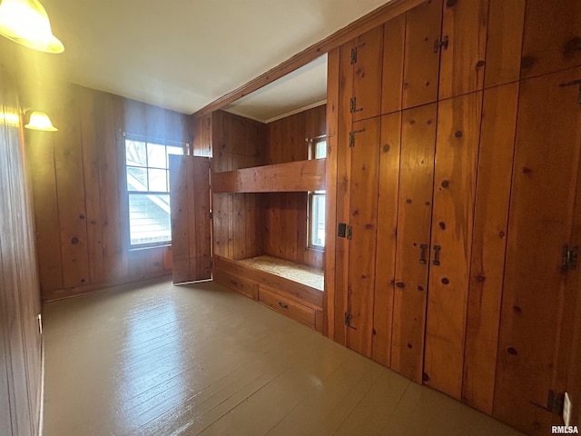 mudroom featuring wood walls and hardwood / wood-style floors