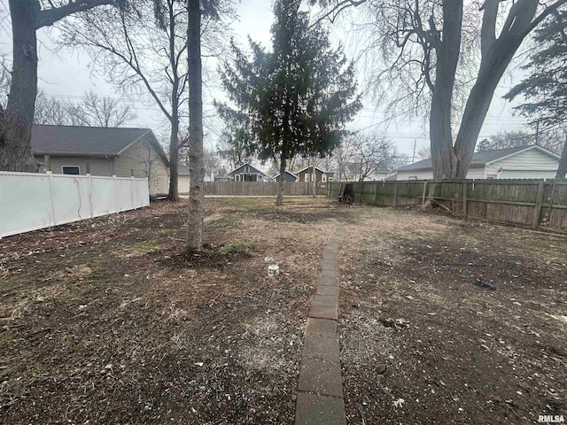 view of yard with a fenced backyard