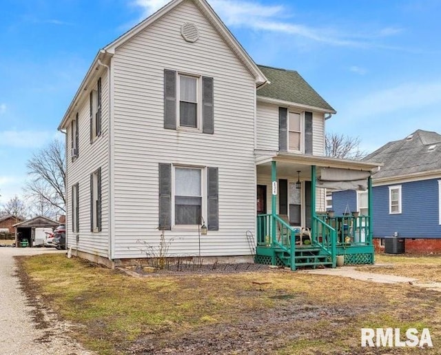 traditional-style home featuring a porch