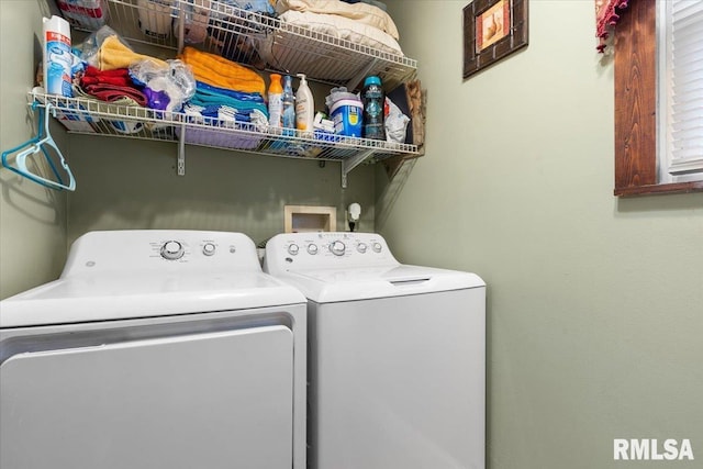 clothes washing area featuring washing machine and dryer and laundry area