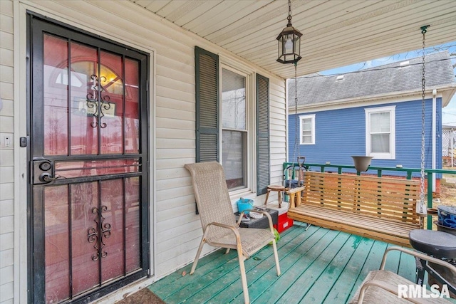 wooden deck featuring covered porch