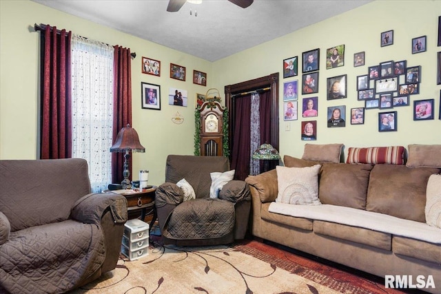 living room featuring a ceiling fan