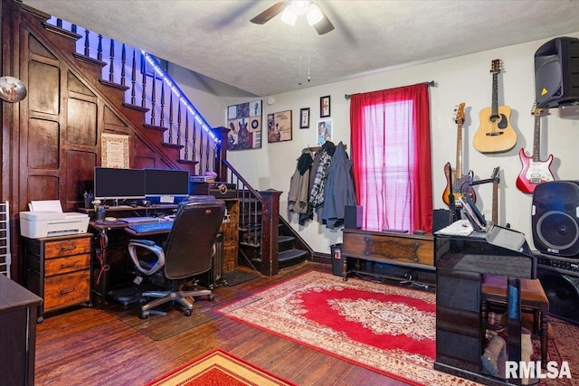 office space with a textured ceiling, ceiling fan, and wood finished floors