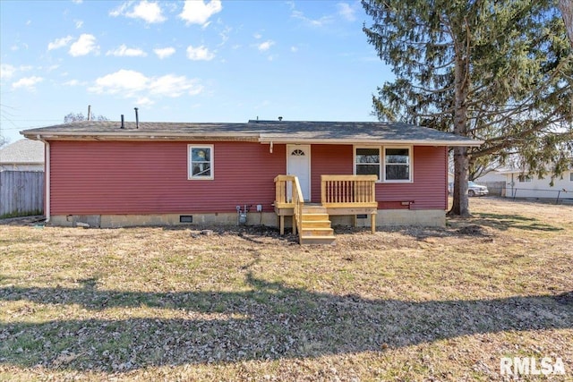 view of front of house featuring crawl space, fence, and a front yard