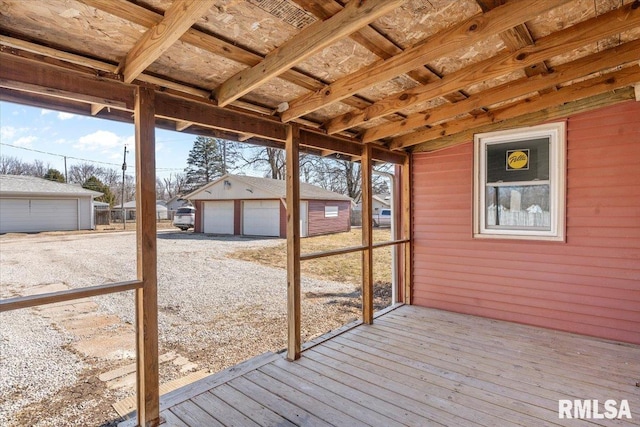 wooden terrace with an outbuilding