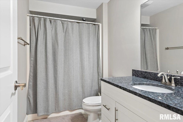 full bath featuring toilet and vanity