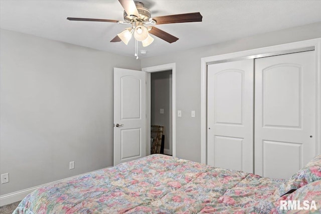 bedroom with baseboards, a closet, and ceiling fan