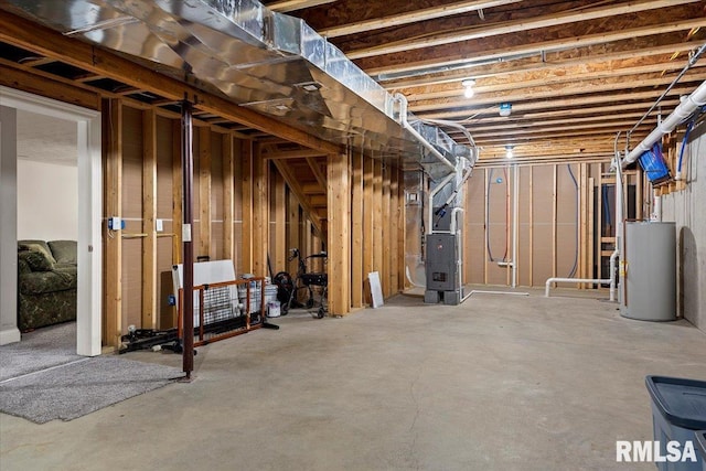 unfinished below grade area featuring gas water heater and heating unit