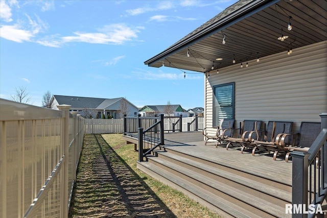 deck with a fenced backyard