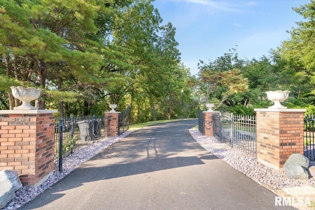 view of gate with fence