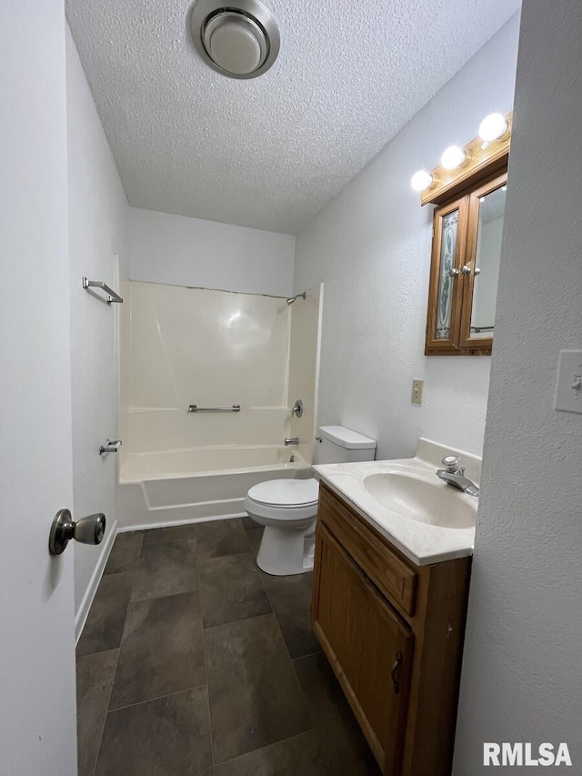 bathroom with toilet, bathtub / shower combination, a textured ceiling, and vanity